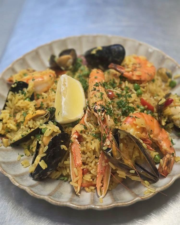 Paella with scampi, mussels and langoustine